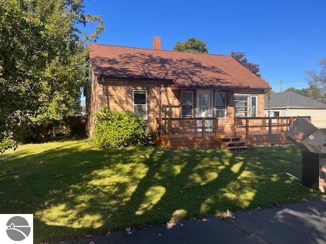 exterior space with a yard and a deck