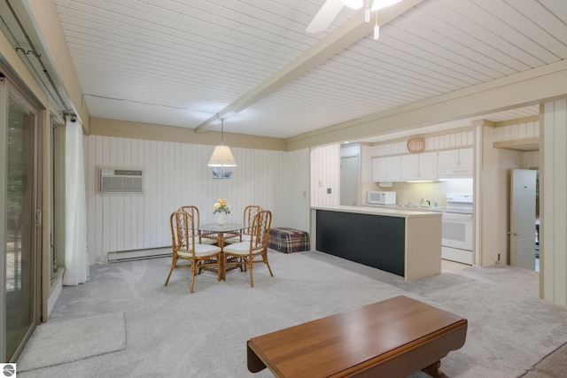 2500 Josef Strasse Unit 410-411, Bellaire, MI 49615 - dining room featuring a baseboard heating unit, light colored carpet, a ceiling fan, and a wall unit AC