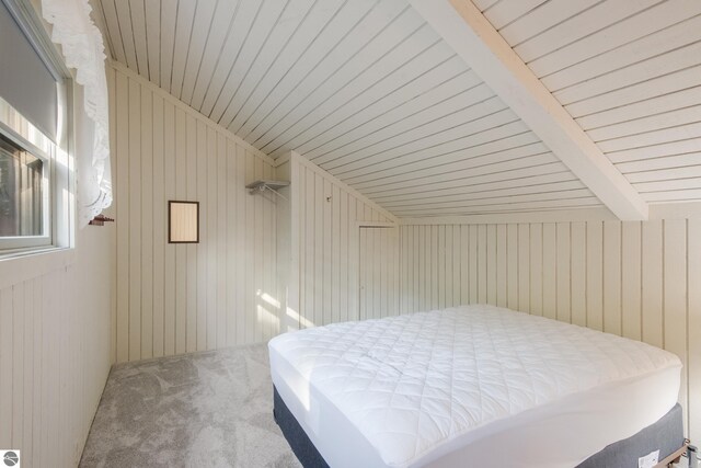 2500 Josef Strasse Unit 410-411, Bellaire, MI 49615 - carpeted bedroom with wooden ceiling and lofted ceiling with beams