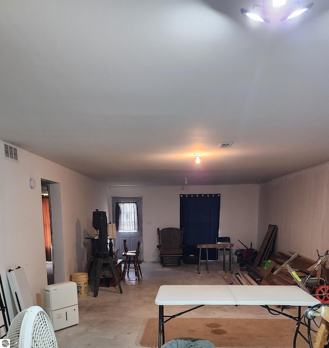 living room featuring concrete flooring