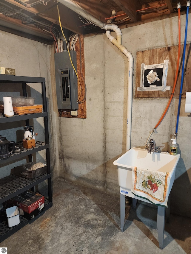 basement featuring sink and electric panel