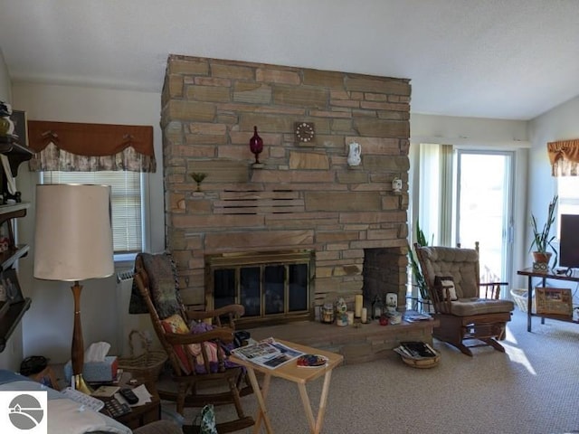 living room with a fireplace, carpet flooring, and lofted ceiling