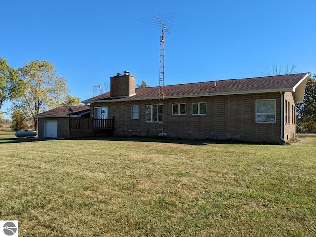 back of house with a lawn