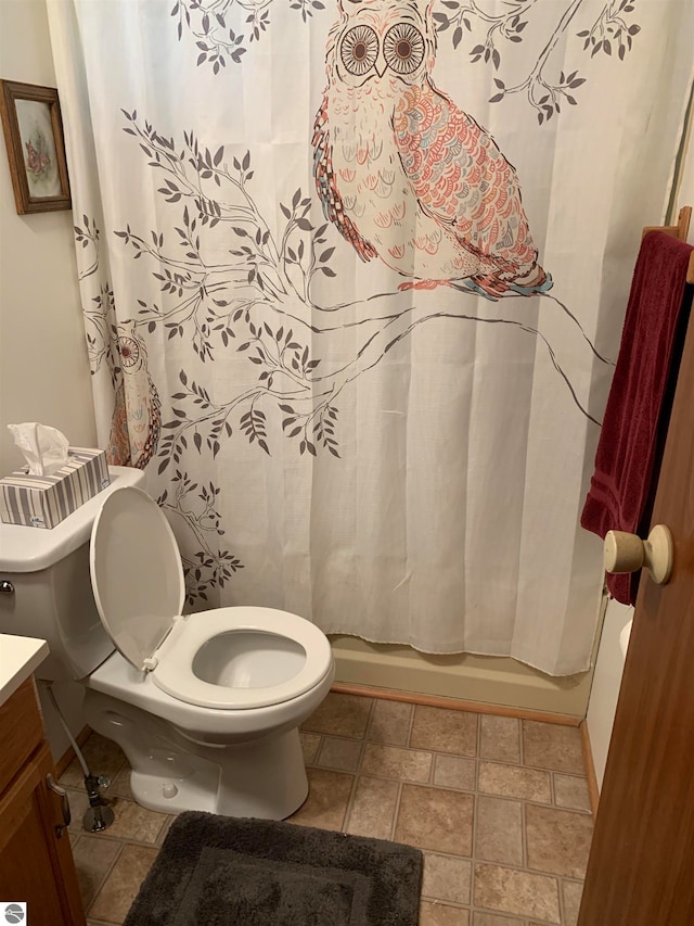 full bathroom featuring shower / tub combo, vanity, and toilet