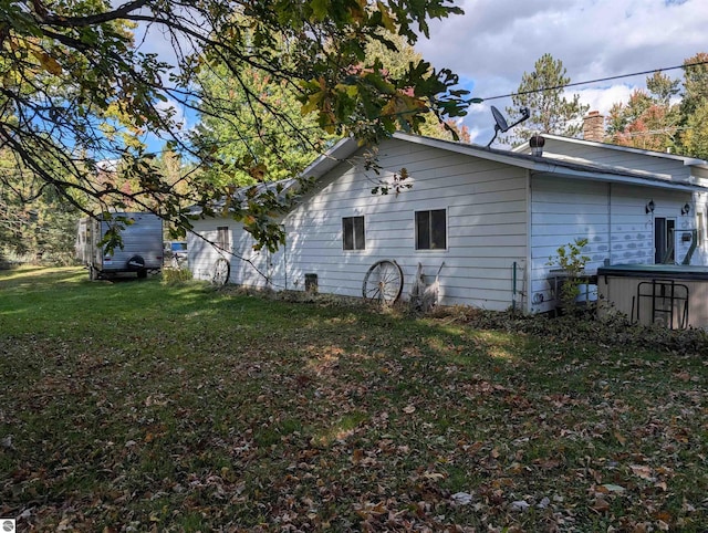 rear view of house with a yard