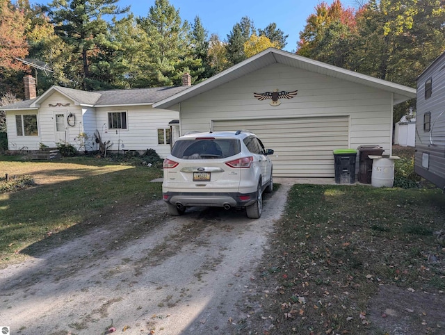 view of front facade with a garage and a front lawn