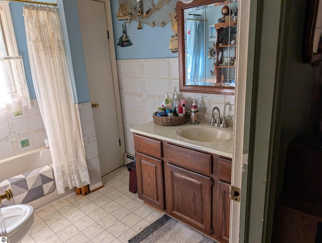 bathroom with tile patterned flooring, shower / tub combo, vanity, a baseboard radiator, and tile walls