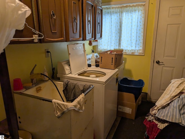 laundry area featuring cabinets and washer and clothes dryer