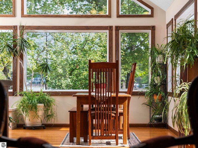 sunroom featuring lofted ceiling