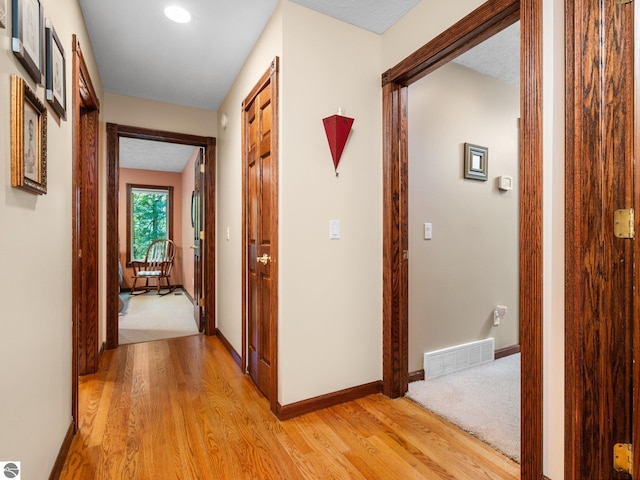 hallway featuring light hardwood / wood-style flooring