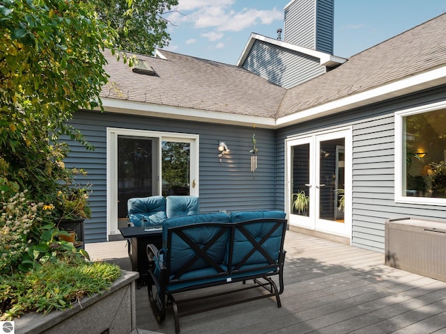 wooden terrace featuring an outdoor hangout area