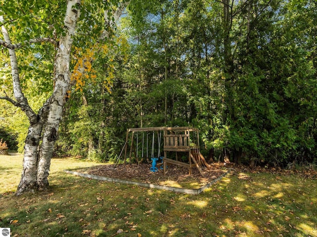 view of jungle gym with a lawn