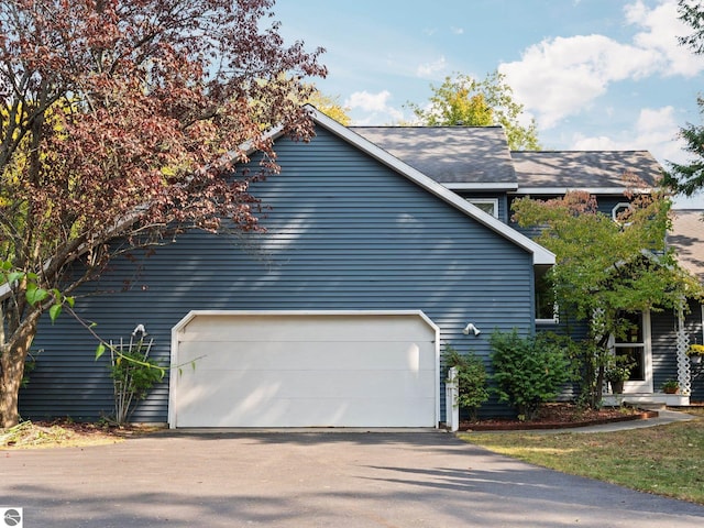 view of side of property featuring a garage