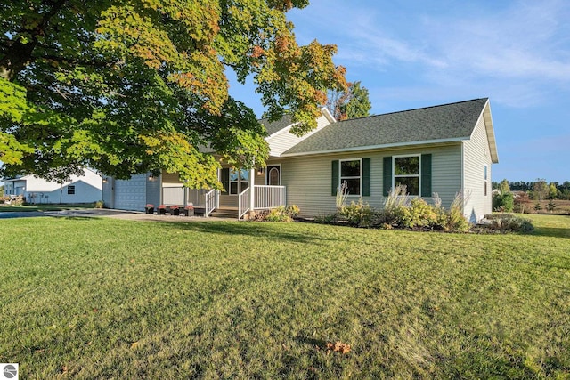 view of front of property featuring a garage and a front yard