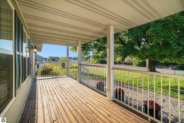 wooden deck with a yard