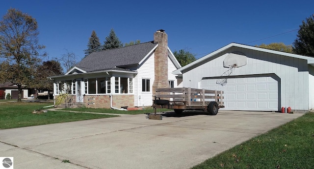 view of front facade with a front yard and a garage