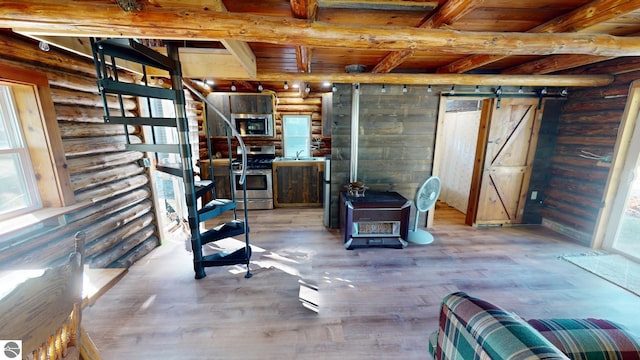 basement with sink, hardwood / wood-style floors, a barn door, and wood ceiling