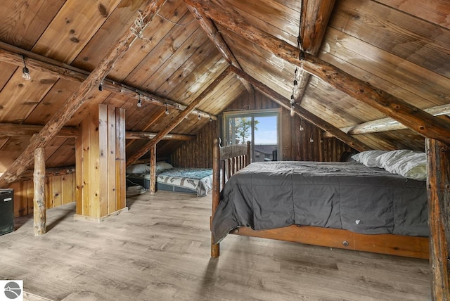 unfurnished bedroom with wood ceiling, vaulted ceiling, and hardwood / wood-style floors