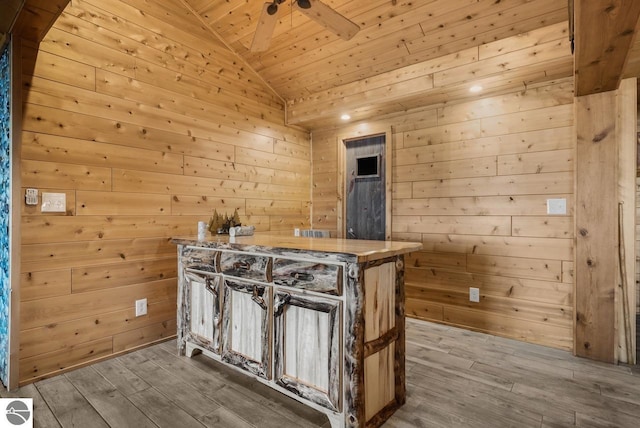 bar with wood ceiling, hardwood / wood-style flooring, wooden walls, and lofted ceiling