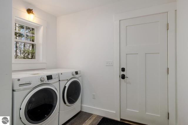 laundry area featuring independent washer and dryer and dark hardwood / wood-style flooring