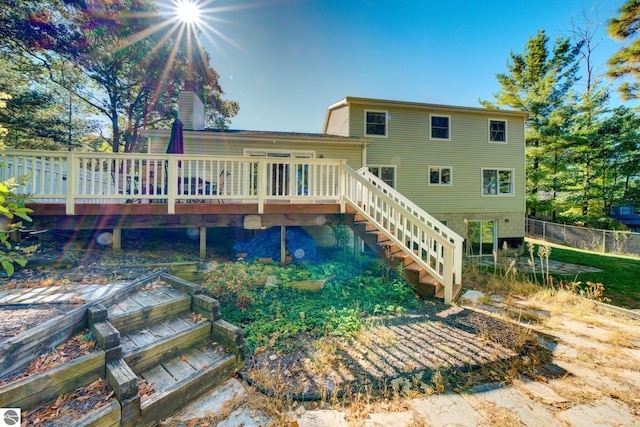 back of property featuring a wooden deck