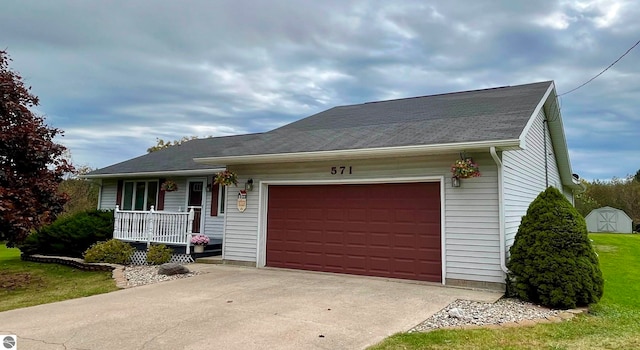 ranch-style home featuring a garage, a porch, and a front yard