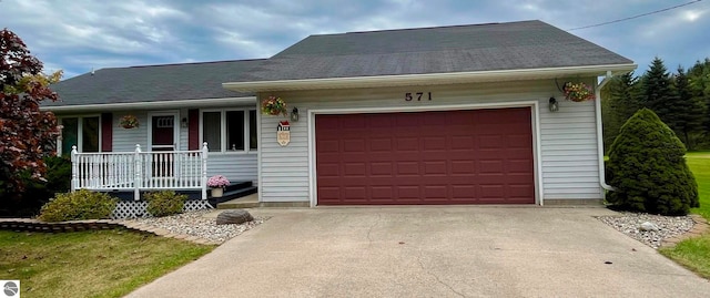 single story home with a garage and a porch