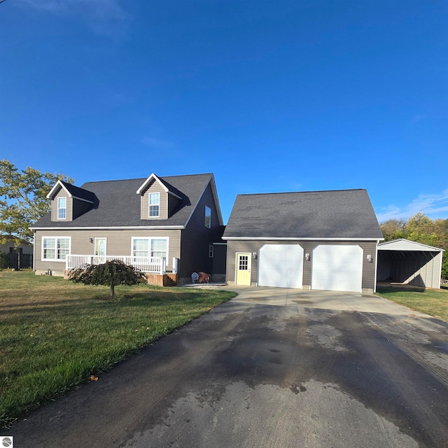 cape cod-style house featuring a garage, a porch, and a front yard