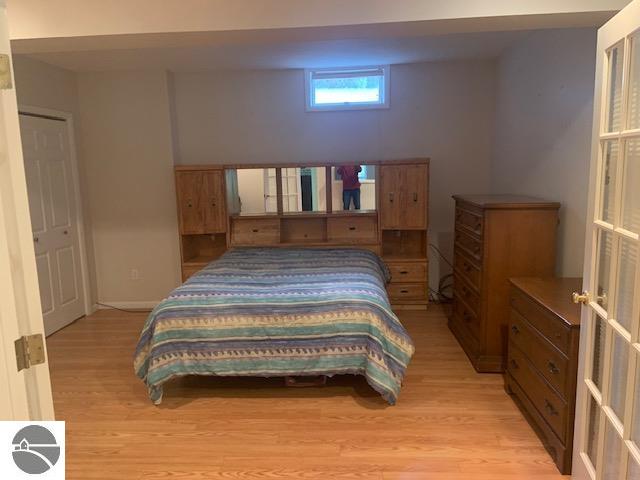 bedroom with light hardwood / wood-style floors