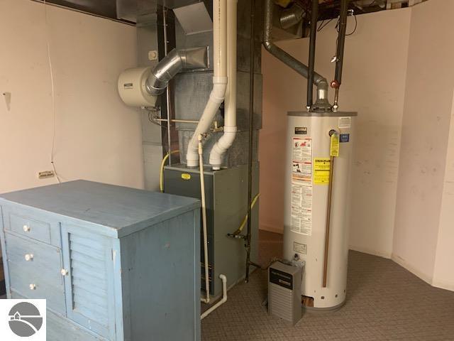 utility room with water heater