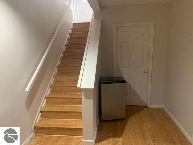 stairway with wood-type flooring