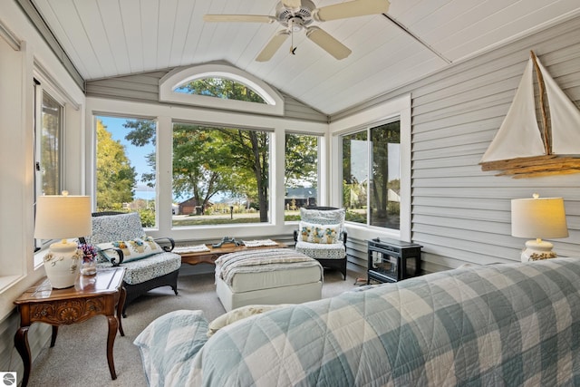 sunroom featuring ceiling fan, lofted ceiling, and wooden ceiling