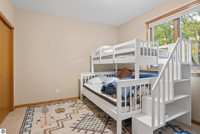 bedroom featuring light carpet