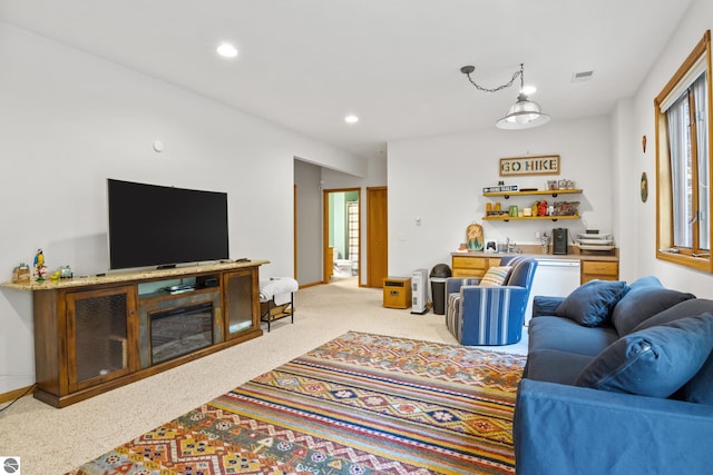 living room featuring light carpet