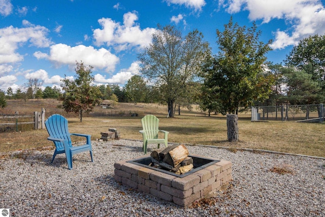 view of yard with an outdoor fire pit