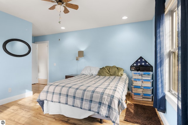 bedroom featuring light wood-type flooring and ceiling fan