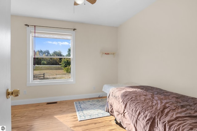 bedroom featuring light hardwood / wood-style floors and ceiling fan