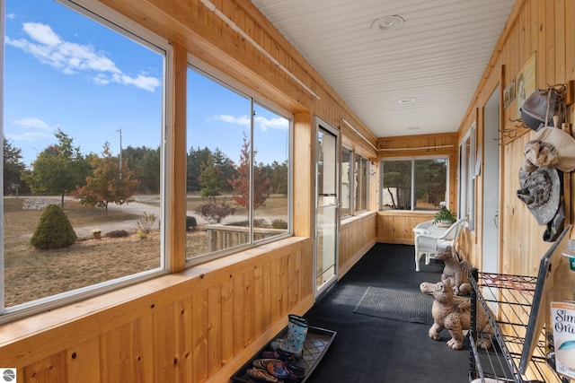 sunroom / solarium featuring a healthy amount of sunlight