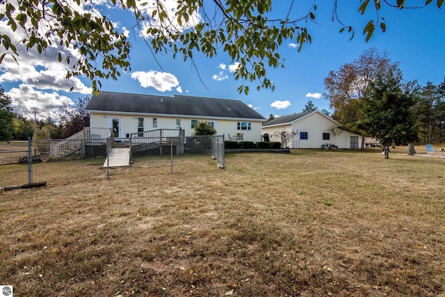 back of house with a yard