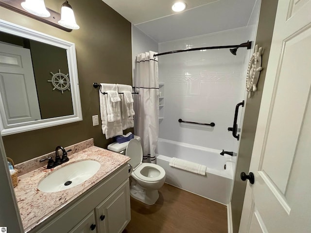 full bathroom with wood-type flooring, shower / bathtub combination with curtain, vanity, and toilet