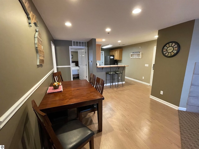 dining room featuring light hardwood / wood-style flooring