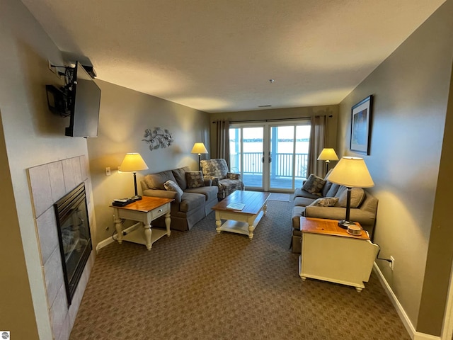 carpeted living room with a fireplace