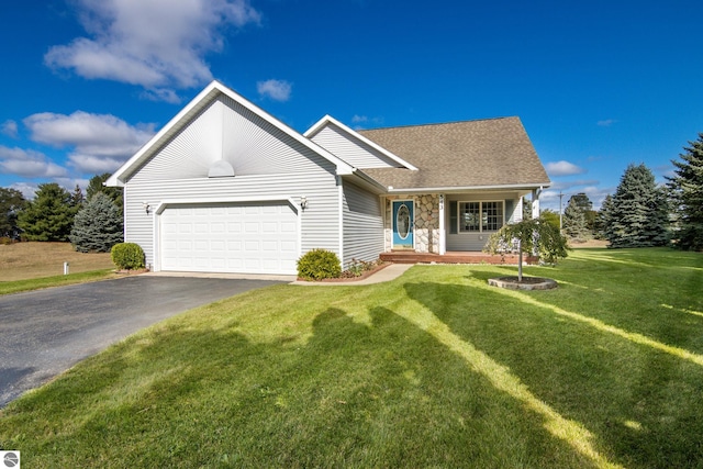 view of front facade featuring a front yard and a garage