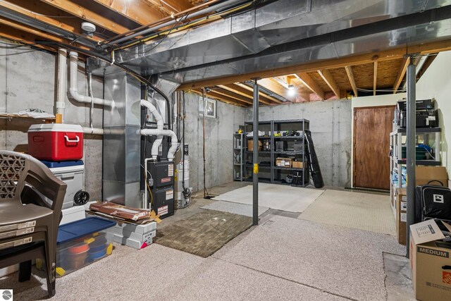 basement featuring heating unit