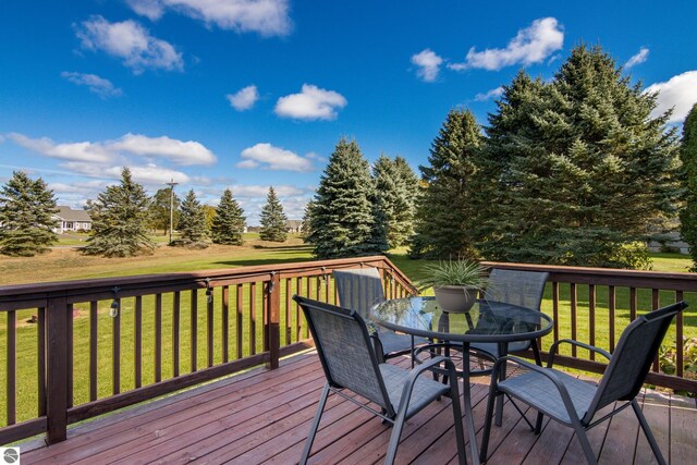 deck featuring a lawn