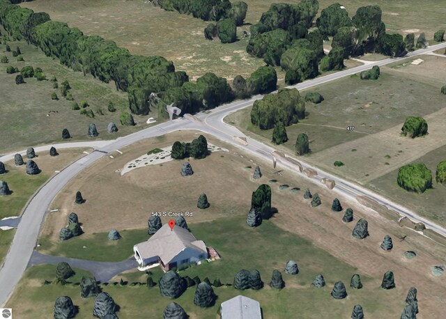 birds eye view of property featuring a rural view