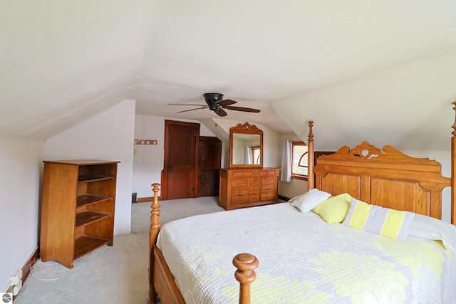 bedroom featuring lofted ceiling, ceiling fan, and light colored carpet