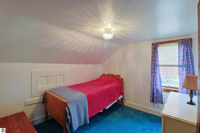 carpeted bedroom featuring vaulted ceiling