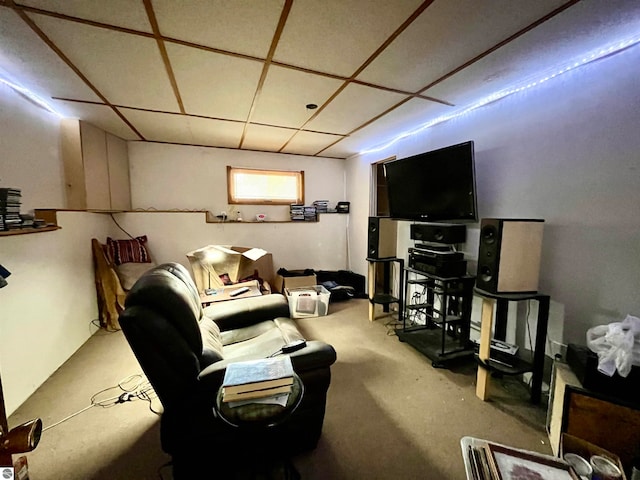 living room featuring a drop ceiling