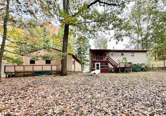 back of property with a wooden deck